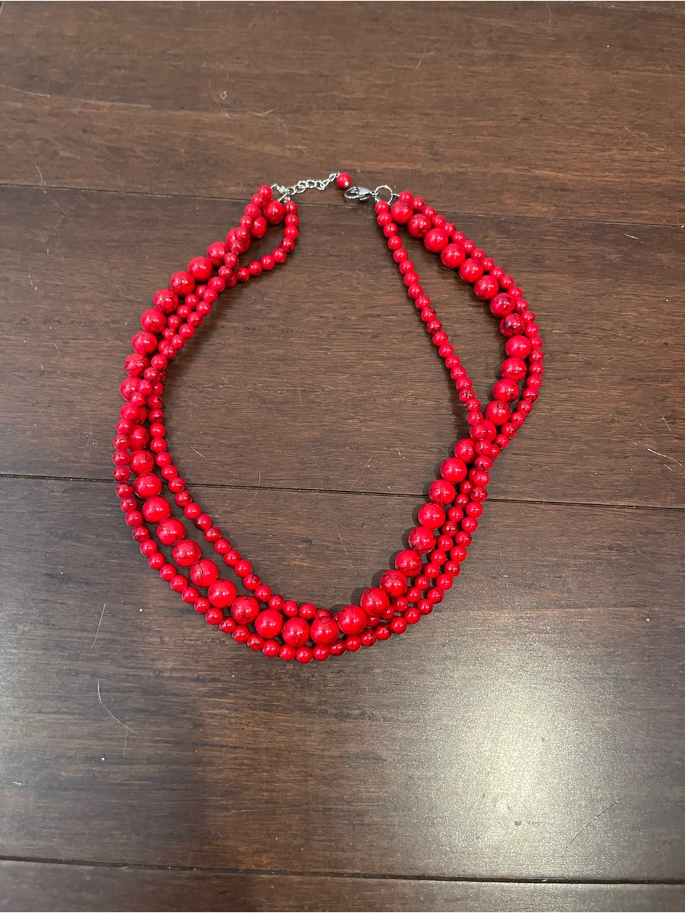 Red beaded necklace with silver hardware
